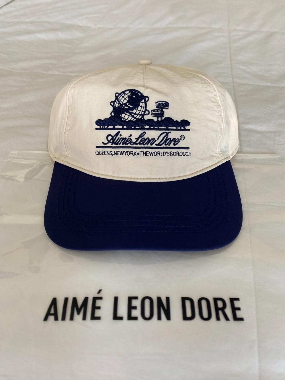 SS25 Aime Leon Dore Unisphere hat in Pristine White & Navy Blue